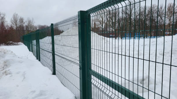 horizontal metal lattice fence is an abstract background.